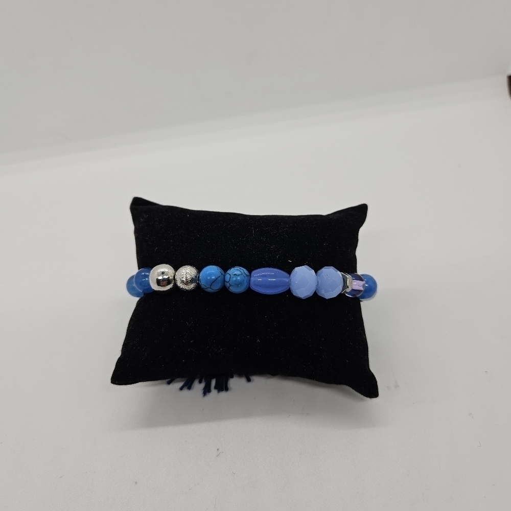 blue beaded stretch bracelet with tassel